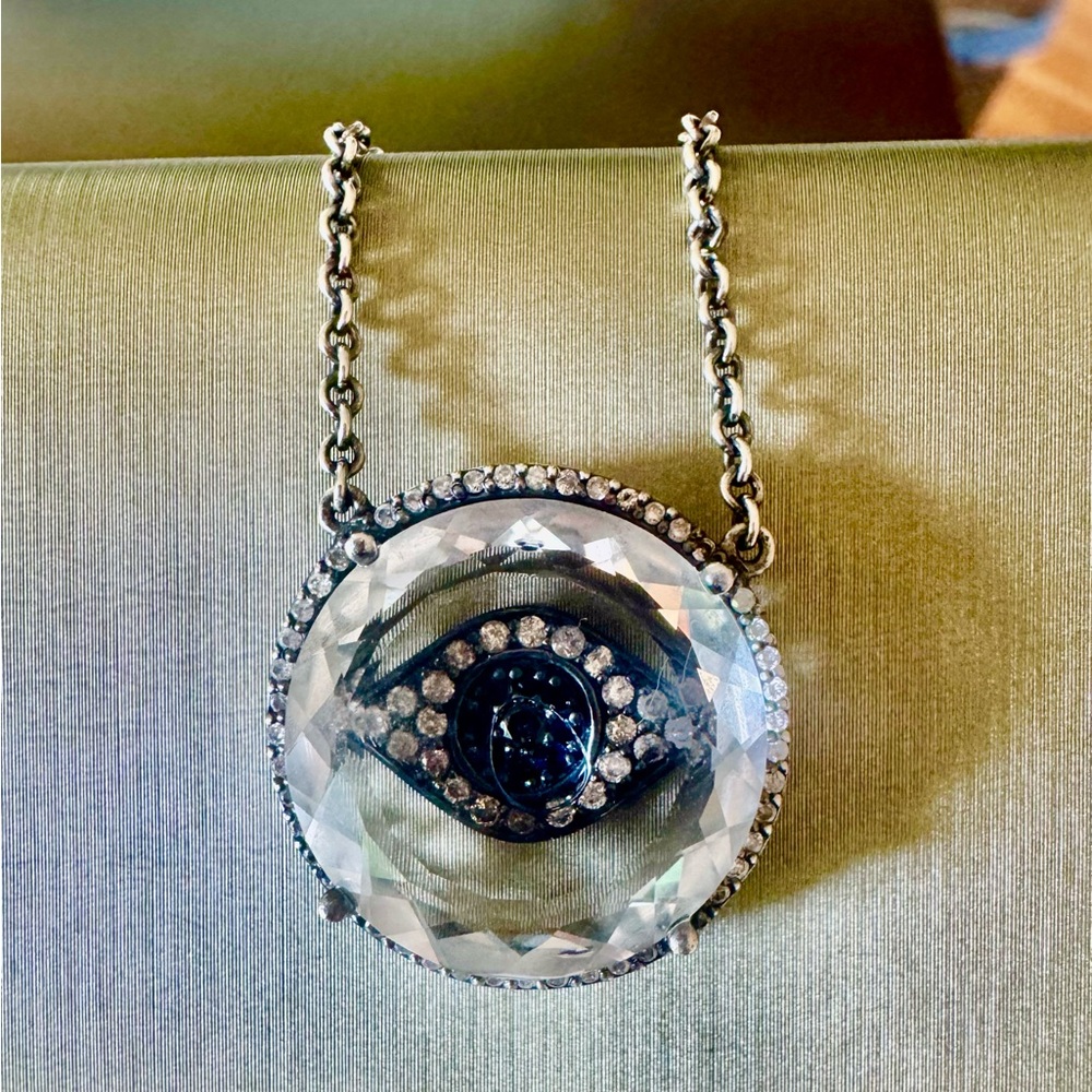 One-of-a-kind evil eye pendant. Silver with sapphire and Indian diamond chips.